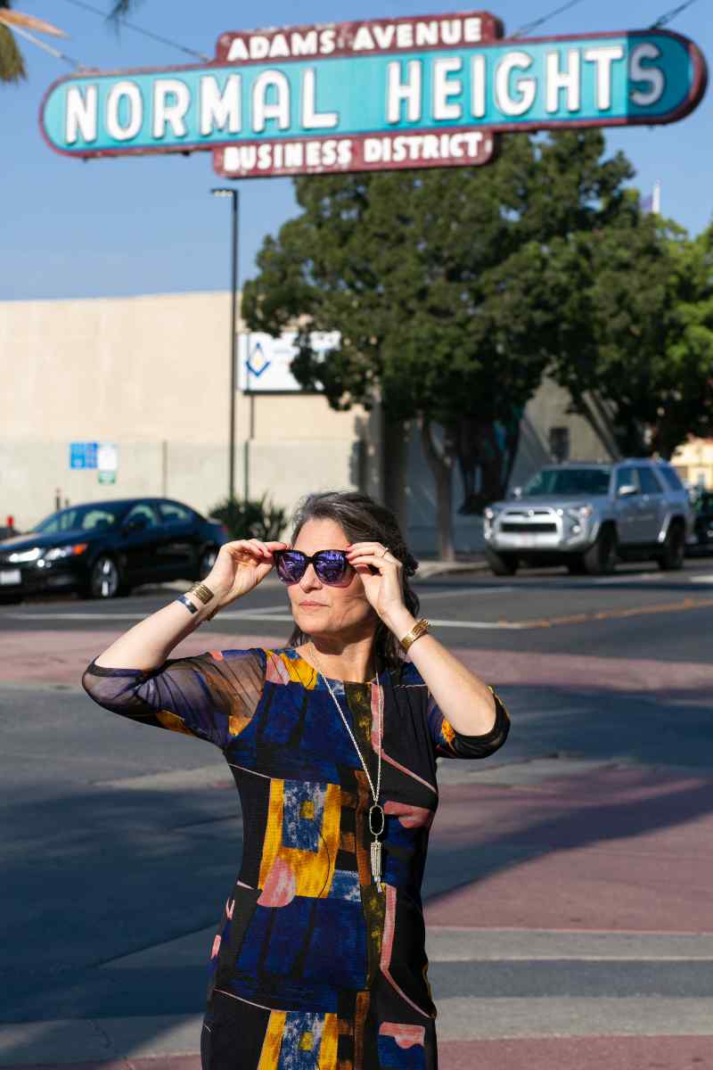 Megan Moore Inc. | Megan Under Normal Heights Sign